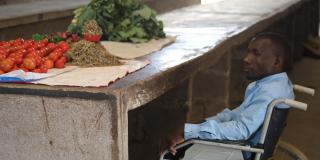 Nkonge selling fruit at his stall