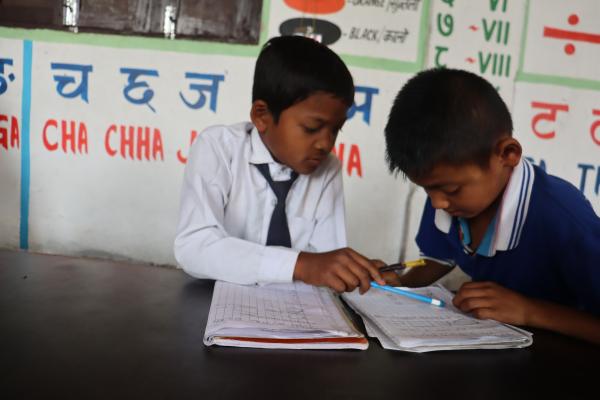 Young boys learning maths