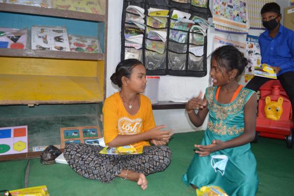 Children using sign language in the classroom