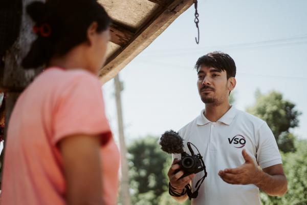 Volunteer speaks with a primary actor