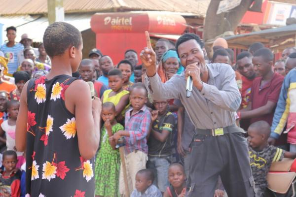 Actors in a scene portraying gender based violence