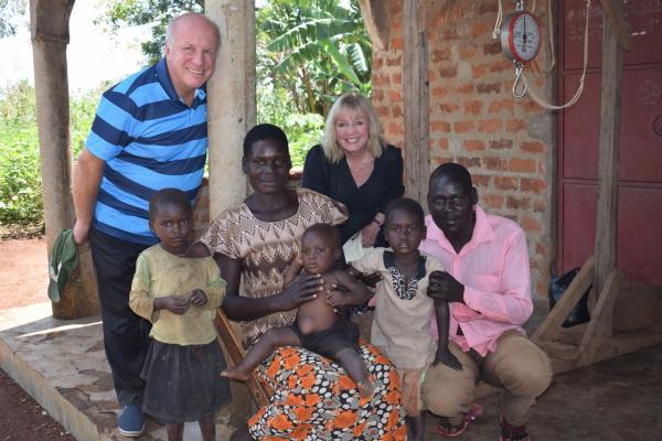 Sue and Greg with local family