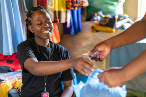 Seamstress Rosaline started her sewing business with help from VSO